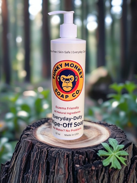 Funky Monkey Soap Co. bottle on a wooden stump with a forest background