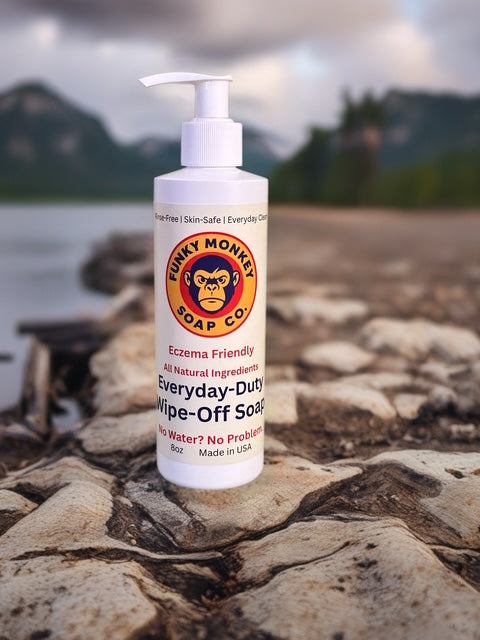 Funky Monkey Soap Co. bottle on a rock with a scenic background
