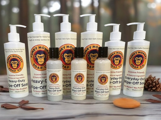Funky Monkey Soap Co. products on a wooden surface with a blurred natural background